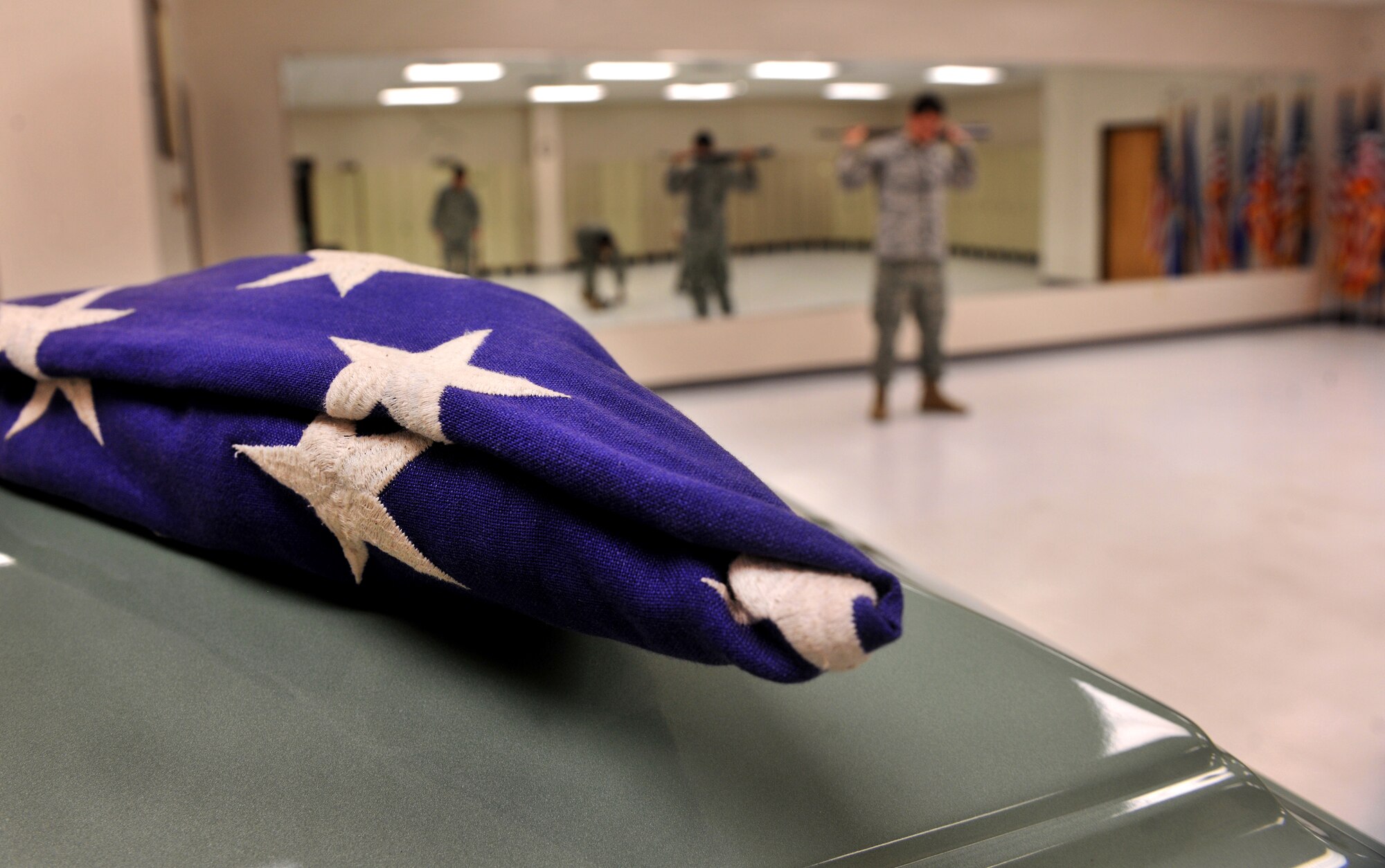 MOODY AIR FORCE BASE, Ga.-- A flag lies on a casket used during training for Moody AFB Honor Guard members March 21. Member of the Honor Guard went over the basics steps and procedures used for ceremonies they’ll attend when assigned to a flight. (U.S. Air Force/Airman 1st Class Joshua Green) (RELEASED)

