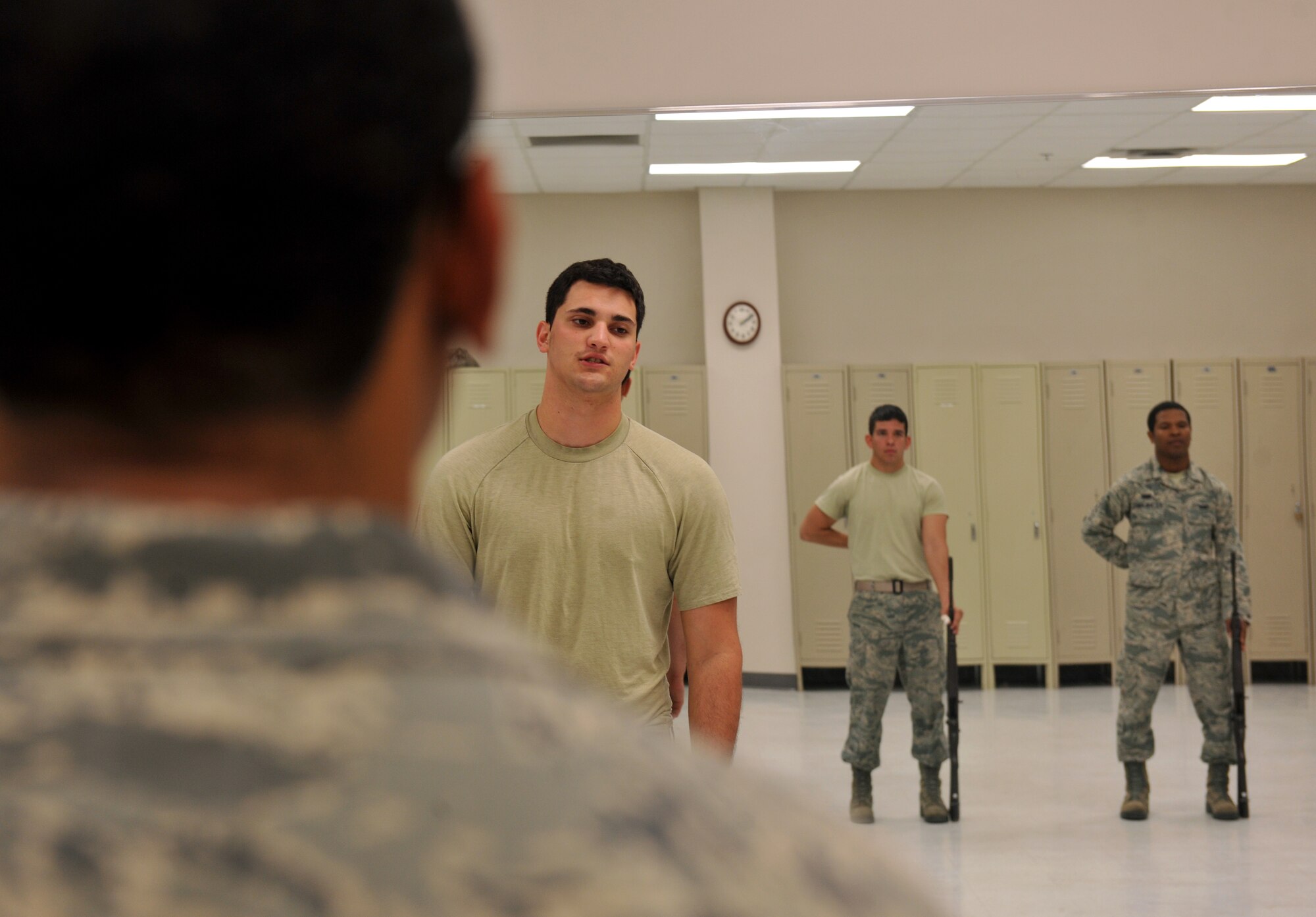 MOODY AIR FORCE BASE, Ga.-- Senior Airman Craig Alessi,  Moody AFB Honor Guard trainer, walks new members through a seven step process during training March 21. Each section to be learned has a certain amount of steps that need to be memorized in order for members to be assigned to a flight. (U.S. Air Force/Airman 1st Class Joshua Green)
