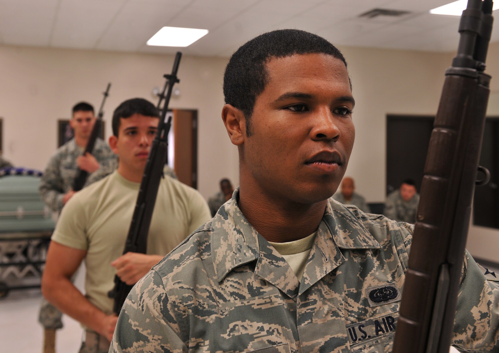 MOODY AIR FORCE BASE, Ga.-- Airman 1st Class Glynn Finnie, Moody AFB Honor Guard, holds his rifle while awaiting a command during a training session March 21. On average Honor Guard members train five to six hours a day and attend three to five details a week. (U.S. Air Force/Airman 1st Class Joshua Green) (RELEASED)
