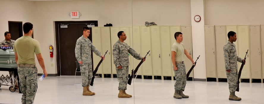 MOODY AIR FORCE BASE, Ga.-- A reflection of Moody AFB Honor Guard members train during a session March 21. The members learned the basic Honor Guard moves so they could be attached to a flight. (U.S. Air Force/Airman 1st Class Joshua Green) (RELEASED)

