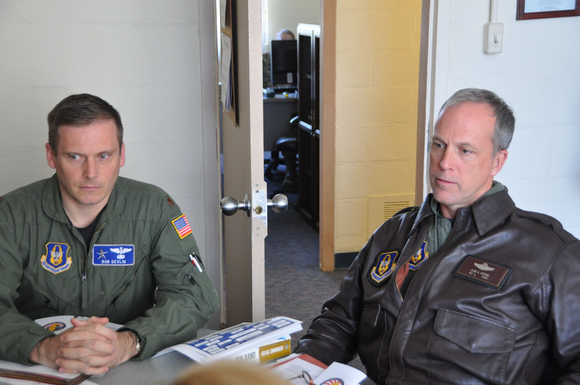 JOINT BASE MCGUIRE-DIX-LAKEHURST, N.J. - Reserve airlift planners, from left, Maj. Robert Devlin and Maj. John Keonig receive an operation security brief in preparation for their deployment to Yokota Air Base, Japan in support of Operation Tomodachi to help with relief efforts for the victims of the March 11 earthquake and tsunami. (U.S. Air Force photo/Master Sgt. Donna T. Jeffries) 
