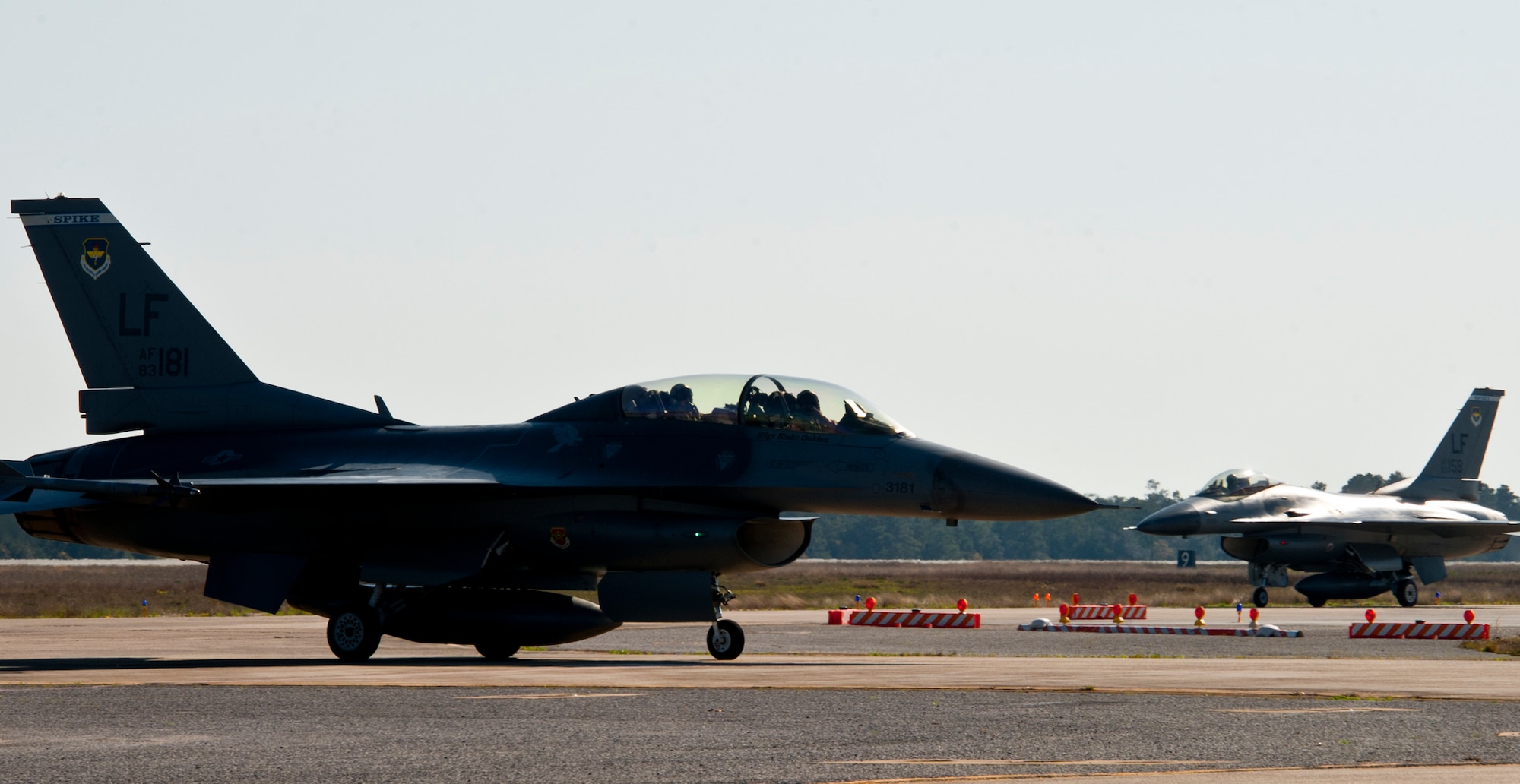 F-16s from Luke Air Force Base, Ariz., taxi in after a morning sortie mission at Eglin Air Force Base, Fla., March 18.  The F-16s were brought here to provide familiarization training to the 33rd Fighter Wing pilots prior to the arrival of the F-35 and to establish a “battle rhythm” for the 33rd flightline operations.  Currently, Marines and Air Force pilots are completing daily sorties.  (U.S. Air Force photo/Samuel King Jr.)