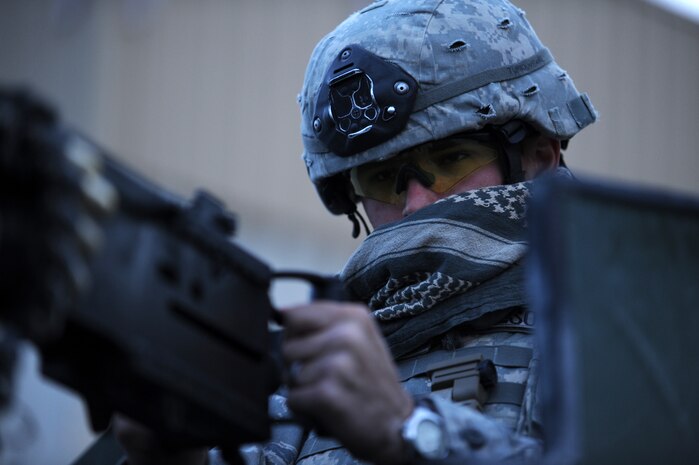 NEVADA TEST AND TRAINING RANGE -- Senior Airman Spencer Carlson, 820th Base Defense Group, 50 Caliber Machine Gunner, looks out for opposing forces during a field training exercise at Exercise Desert Eagle on the Nevada Test and Training Range March 14, 2011. Desert Eagle is integrated training between No.1 Squadron, RAF Regiment and the 820th Base Defense Group Moody Air Force Base Ga., to improve both nations ability to work together during present and future contingencies. (U.S. Air Force photo by Airman 1st Class Daniel Hughes/Released)