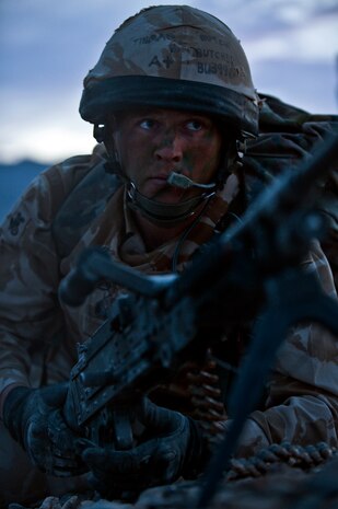NEVADA TEST AND TRAINING RANGE -- Royal Air Force Senior Aircraftsman Sam Kennedy, No.1 Squadron, Regiment 4 Force Protection Wing security forces, scans his sector for targets during exercise Desert Eagle March 16. Desert Eagle is an integrated training between No. 1 Squadron, Royal Air Force Regiment and the 820th Base Defense Group from Moody Air Force Base, Ga., to improve both nations ability work together during present and future contingencies. (U.S. Air Force photo by Tech. Sgt. Michael R. Holzworth)