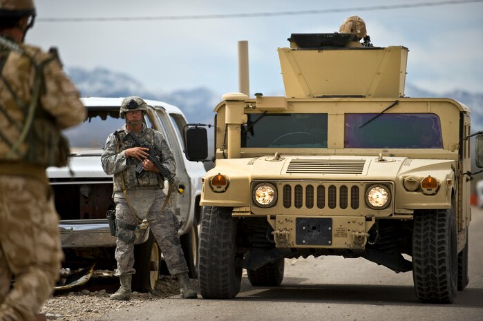 NEVADA TEST AND TRAINING RANGE -- Tech. Sgt. Michael Warnsing, 820th Base Defense Group, stands guard next to a HUMVEE during a field training exercise at exercise Desert Eagle on the NTTR March 15. Desert Eagle is integrated training between No.1 Squadron, RAF Regiment and the 820th Base Defense Group Moody Air Force Base Ga., to improve both nations ability to work together during present and future contingencies. (U.S. Air Force photo by Airman 1st Class George Goslin)