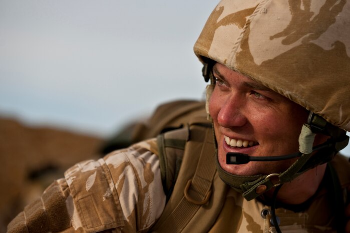 NEVADA TEST AND TRAINING RANGE -- Royal Air Force Cpl. Chris Sheehan from No. 1 Squadron, Regiment 4 Force Protection Wing security forces share a laugh with his quick reaction force teammates during a field training exercise on the NTTR as part of exercise Desert Eagle March 14. Desert Eagle is an integrated training between No. 1 Squadron, Royal Air Force Regiment and the 820th Base Defense Group from Moody Air Force Base, Ga., to improve both nations ability work together during present and future contingencies. (U.S. Air Force photo by Tech. Sgt. Michael R. Holzworth)
