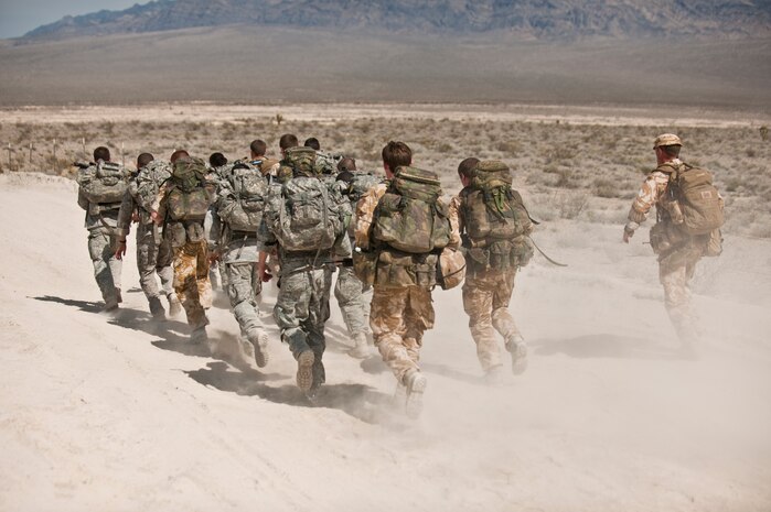 NEVADA TEST AND TRAINING RANGE -- Airmen from the 822nd Base Defense Squadron, Moody Air Force Base Ga., and Royal Air Force No. 1 Squadron, Regiment 4 Force Protection Wing security forces participate in a 6 mile march during exercise Desert Eagle March 12. Desert Eagle is an integrated training between No. 1 Squadron, Royal Air Force Regiment and the 820th Base Defense Group from Moody Air Force Base, Ga., to improve both nations ability work together during present and future contingencies. (U.S. Air Force photo by Tech. Sgt. Michael R. Holzworth)