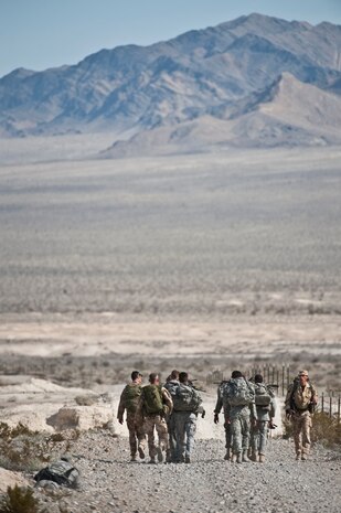 NEVADA TEST AND TRAINING RANGE -- Airmen from the 822nd Base Defense Squadron, Moody Air Force Base Ga., and Royal Air Force No. 1 Squadron, Regiment 4 Force Protection Wing security forces participate in a 6 mile march during  exercise Desert Eagle March 12. Desert Eagle is an integrated training between No. 1 Squadron, Royal Air Force Regiment and the 820th Base Defense Group from Moody Air Force Base, Ga., to improve both nations ability work together during present and future contingencies. (U.S. Air Force photo by Tech. Sgt. Michael R. Holzworth)