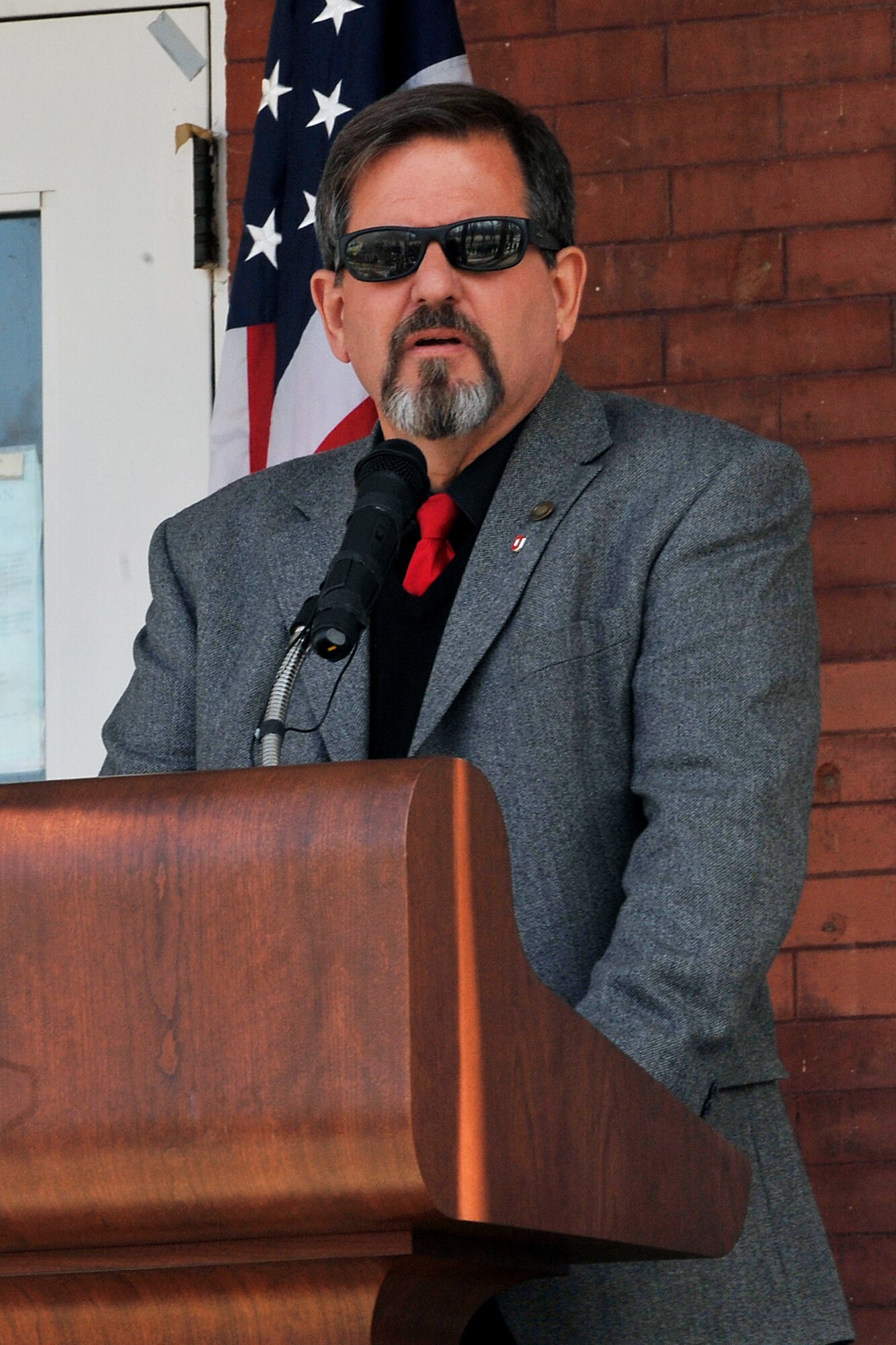 OFFUTT AIR FORCE BASE, Neb. - Cobra Ball 61-2664 crash survivor, Dr. K.A. Crooks, addresses attendees at the 30th anniversary memorial service of the crash held here at the 45th Reconnaissance Squadron headquarters March 15. Friends and family of the surviving crew members attended the service and toured a Cobra Ball static display. U.S. Air Force Photo by Charles Haymond