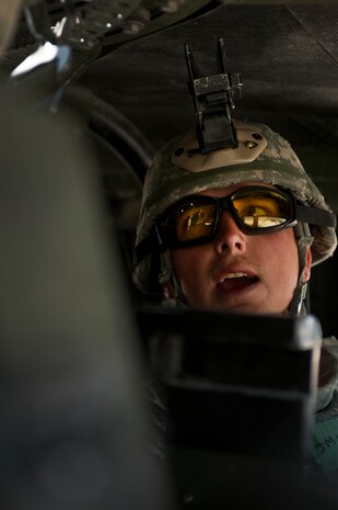 NEVADA TEST AND TRAINING RANGE -- Staff Sgt. Justin Miller 822nd Base Defense Squadron give command to the gunner while driving a HUMVEE during a field training exercise on the NTTR as part of exercise Desert Eagle March 14. Desert Eagle is an integrated training between No. 1 Squadron, Royal Air Force Regiment and the 820th Base Defense Group from Moody Air Force Base, Ga., to improve both nations ability work together during present and future contingencies. (U.S. Air Force photo by Tech. Sgt . Michael R. Holzworth)