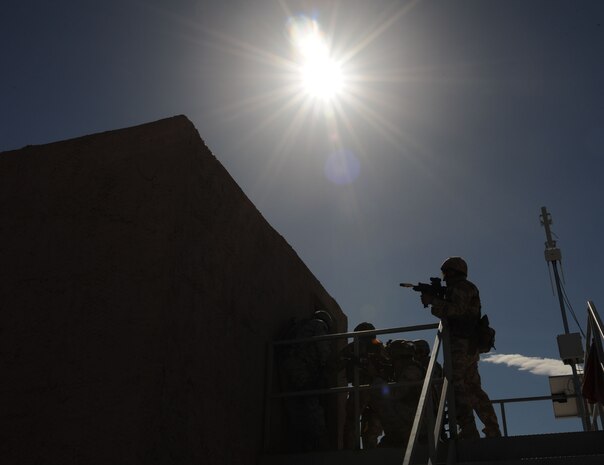 NEVADA TEST AND TRAINING RANGE -- Participants of exercise Desert Eagle from the 822nd Base Defense Squadron, Moody Air Force Base, Ga and the No. 1 Squadron, Royal Air Force Regiment, practice building clearing during training March 9. Exercise Desert Eagle is integrated training between No. 1 Squadron, Royal Air Force Regiment and the 820th Base Defense Group from Moody Air Force Base, Ga., to improve both nations ability to work together during present and future contingencies. (U.S. Air Force photo by Staff Sgt. Taylor Worley)