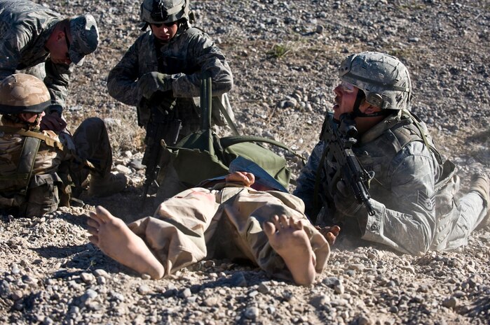 NEVADA TEST AND TRAINING RANGE -- Staff Sgt. Nathan Garrison calls for medical assistance for a casualty during exercise Desert Eagle March 9. Exercise Desert Eagle is integrated training between No. 1 Squadron, RAF Regiment and the 820th Base Defense Group from Moody Air Force Base, Ga., to improve both nations ability work together during present and future contingencies.(U.S. Air Force photo by Senior Airman Brett Clashman)