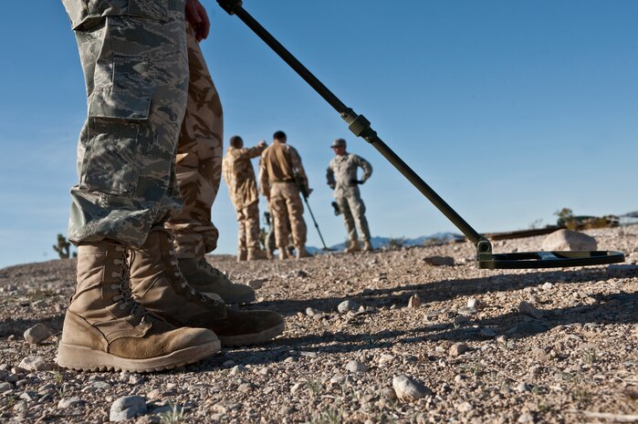 NEVADA TEST AND TRAINING RANGE -- Senior Airman Jeremy Spanski, 820th Base Defense Group, Moody Air Force Base Ga., uses a Vallon VMH3CS Improvised Explosive Device finder during exercise Desert Eagle March 8. Desert Eagle is integrated training between No. 1 Squadron, RAF Regiment and the 820th Base Defense Group from Moody AFB, to improve both nations ability work together during present and future contingencies. (U.S. Air Force photo by Tech Sgt. Michael R. Holzworth)
