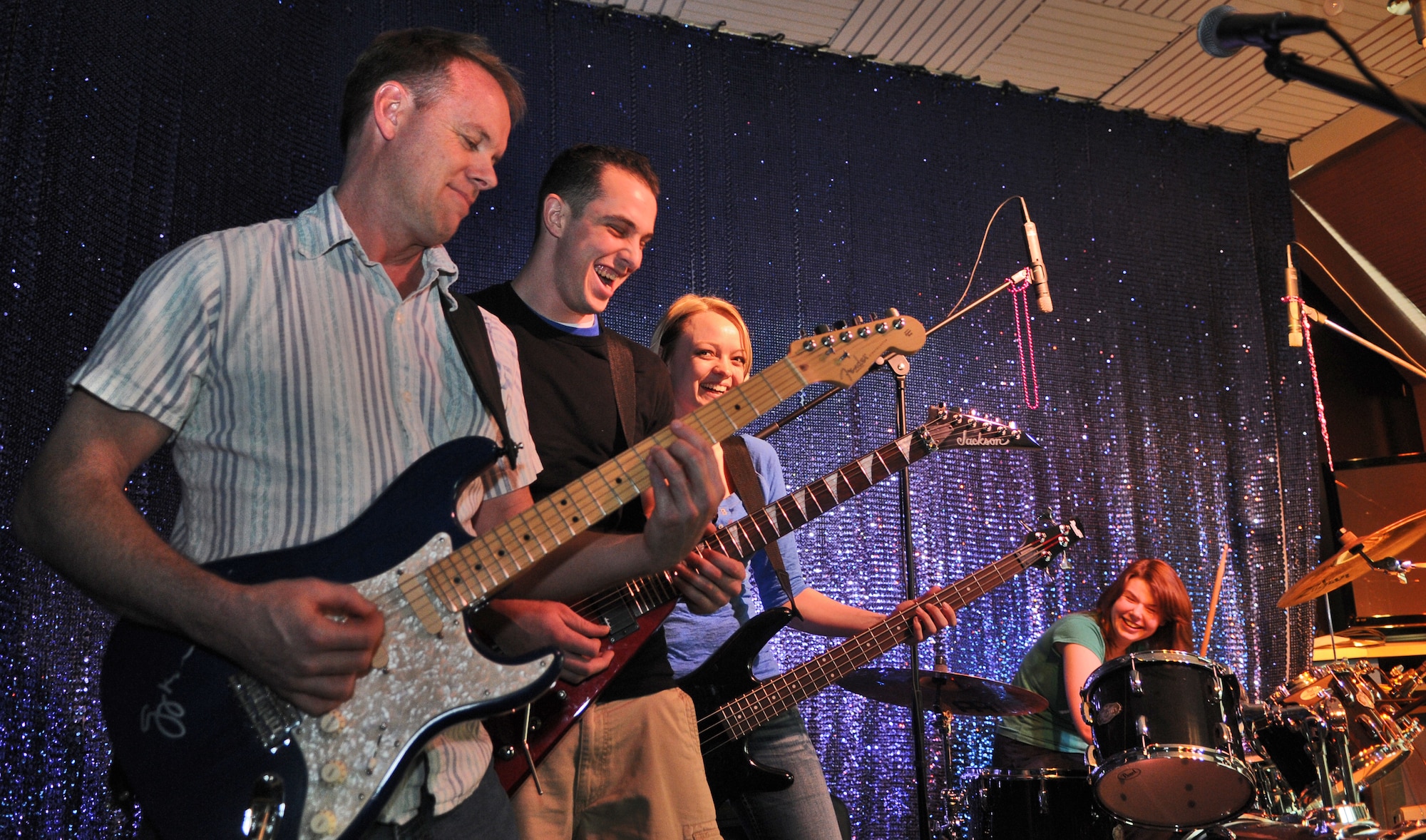 SPANGDAHLEM AIR BASE, Germany – Todd Credaroli, 52nd Force Support Squadron music center coordinator, plays a song with Heather Moher and Ashley Hall, both 52nd Force Support Squadron recreation assistants, and Airman 1st Class Curtis Duke, 52nd Security Forces Squadron patrolman, in the Brick House’s music studio March 11. The studio officially opened on March 3 and has electric guitars, a drum set, a keyboard and recording equipment available to all base members 18 years and older from noon - 8 p.m. Monday through Saturday. (U.S. Air Force photo/Senior Airman Nick Wilson) 