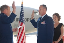 Col. Charles Combs, center, takes the oath of office after pinning on the rank of colonel during a ceremony held on Friday, March 18, His wife, Denise, and Colonel Cam LeBlanc did the honors of pinning on the new rank. (USAF photo by Maj. Shannon Mann, 916PA)