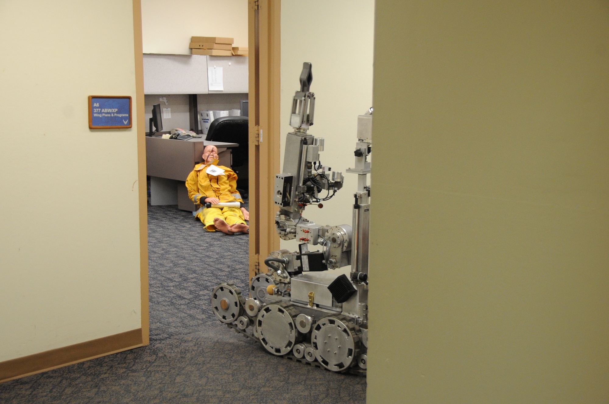 A 377th Explosive Ordnance Flight robot enters Building 20604 to bring out a possible pipe bomb during an active shooter exercise.  U.S. Air Force  Photo by Dennis Carlson
