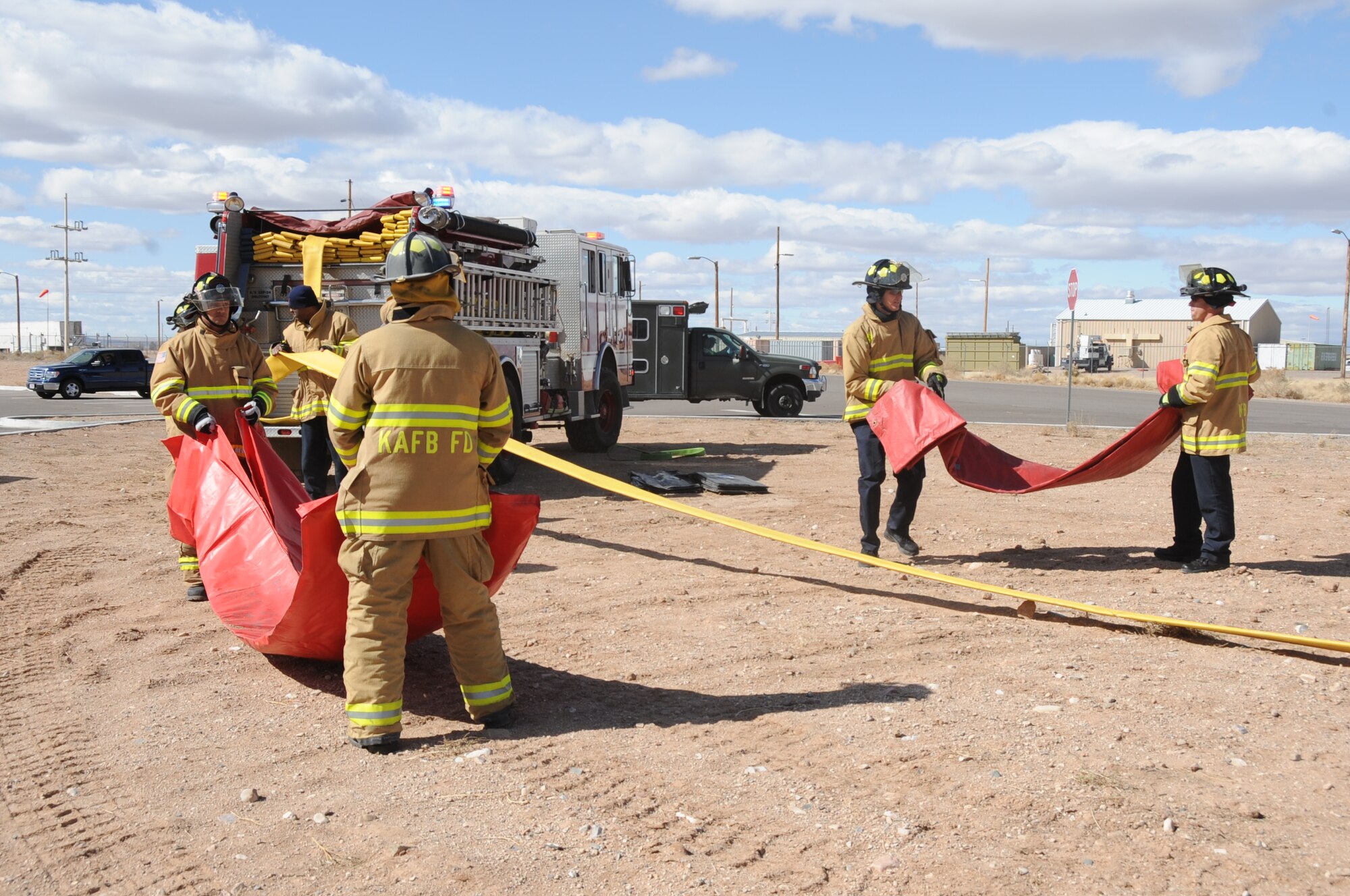 Firefighters set up decontamination stations during a suspicious package exercise.  U.S. Air Force  Photo by Dennis Carlson