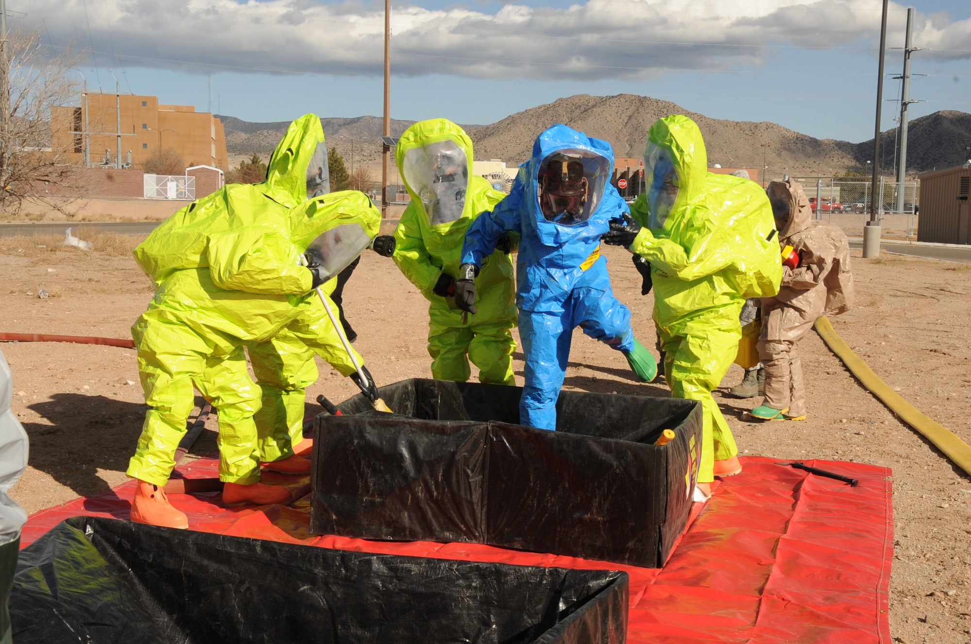 Airmen practice decontamination procedures during a suspicious-package exercise.  U.S. Air Force  Photo by Dennis Carlson