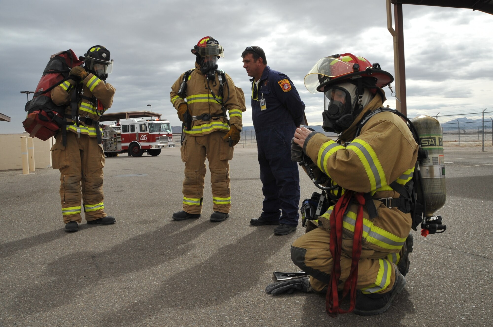 Firefighters prepare for action during an exercise in Building 381.  U.S. Air Force  Photo by Todd Berenger