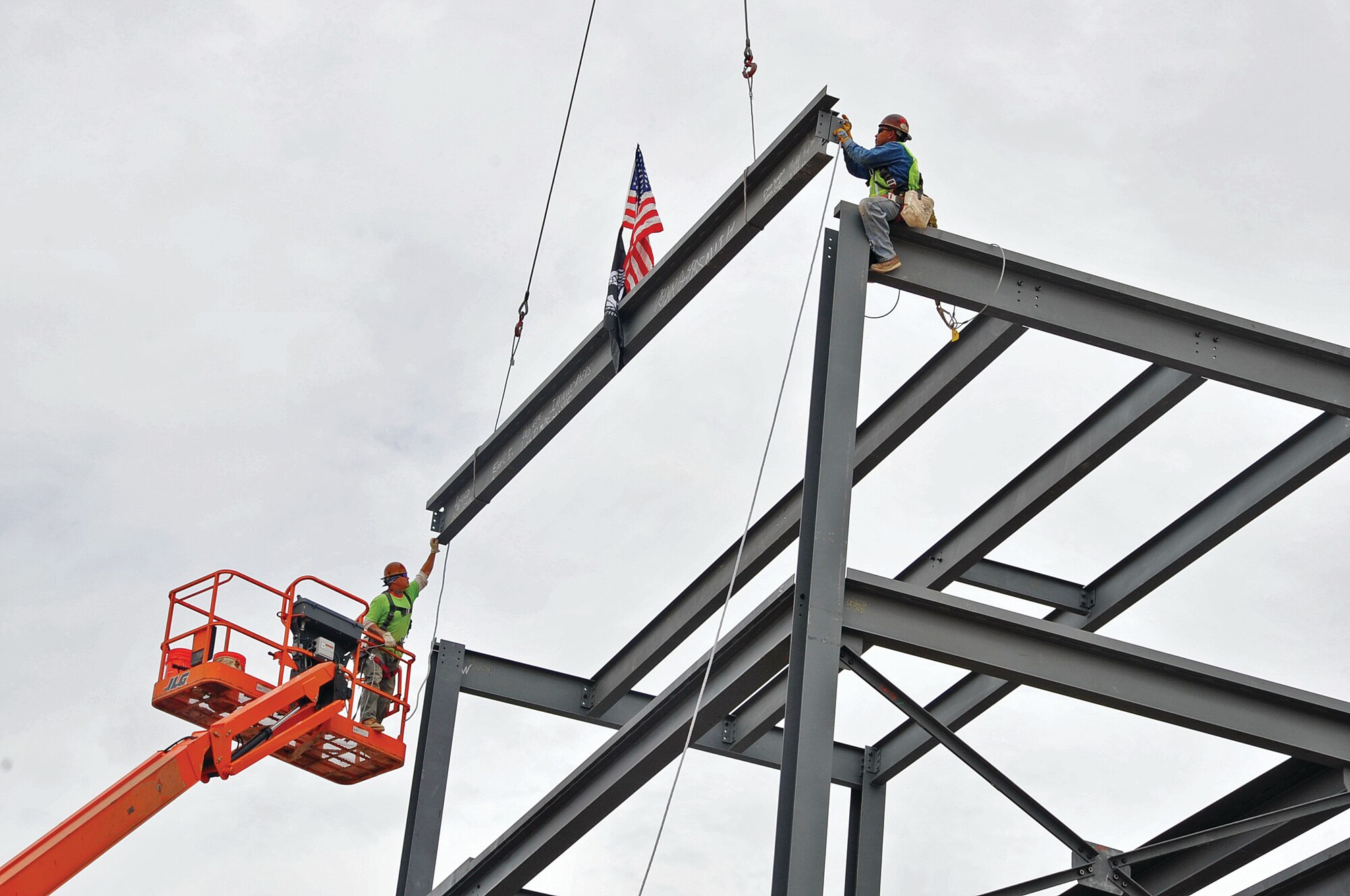 The construction of the Battlespace Environment Laboratory began August 26, 2009, and was completed by September 2010. The 145,000 square foot, two-story laboratory is on Carlisle and Gibson. The picture shows when the last piece of steel was placed on the facility, called “topping-off.” Workers used an 80-ton crane to lift the last 30-foot steel beam and place it on the roof. The largest beam lifted by the crane was 62 feet long and weighed 5 tons. The new facility will house the people relocating from Hanscom AFB, Mass.  U.S. Air Force  Photo by Elizabeth Martinez