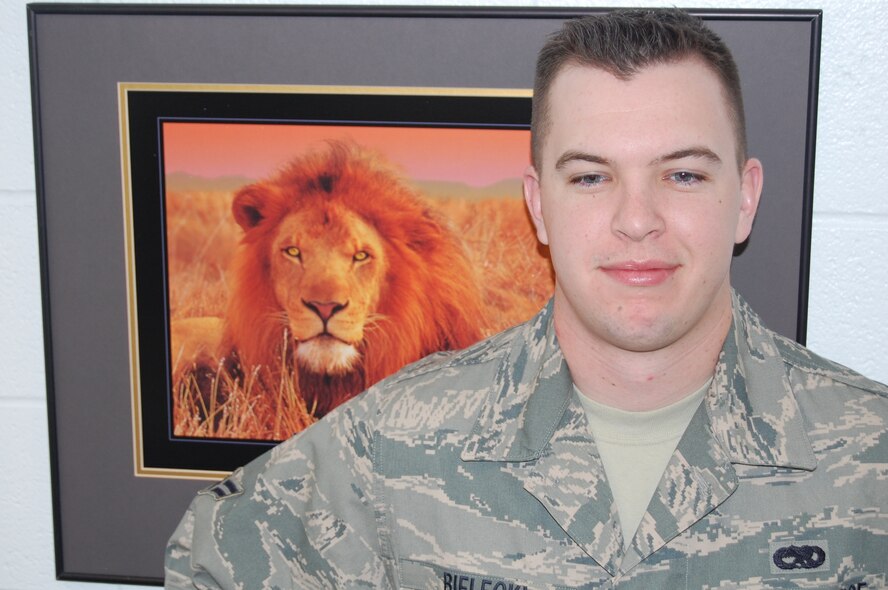 Name: A1C Jonathan V. Bielecki

Squadron: 898 MUNS

AFSC/Duty Title: 2W231/Weapons Maintenance Team Member 

Hometown: Baltimore, MD

Goals: Long term-Coach football at the collegiate level; Short-term-Promote to SrA

Accomplishment:  A1C Bielecki is a weapons maintenance team member with 898 MUNS.  Airman Bielecki is responsible for maintaining Protection Level (PL) 1 assets in DOD's only underground storage complex and providing technical support for 150 logistical redistributions each year, all while complying with nuclear explosive safety requirements and SECAF directed weapon system safety rules.  Additionally, Airman Bielecki manages more than 200 classified and unclassified technical orders, enabling the unit to properly perform maintenance actions on PL1 assets.  Airman Bielecki has volunteered his personal time speaking to new Airmen at FTAC, helping them identify and avoid common pitfalls for junior enlisted members.  Recently, A1C Bielecki displayed alertness when he successfully extinguished a fire in the KUMMSC smoke pit after the butt can caught fire, quickly and safely resolving a dangerous situation.
