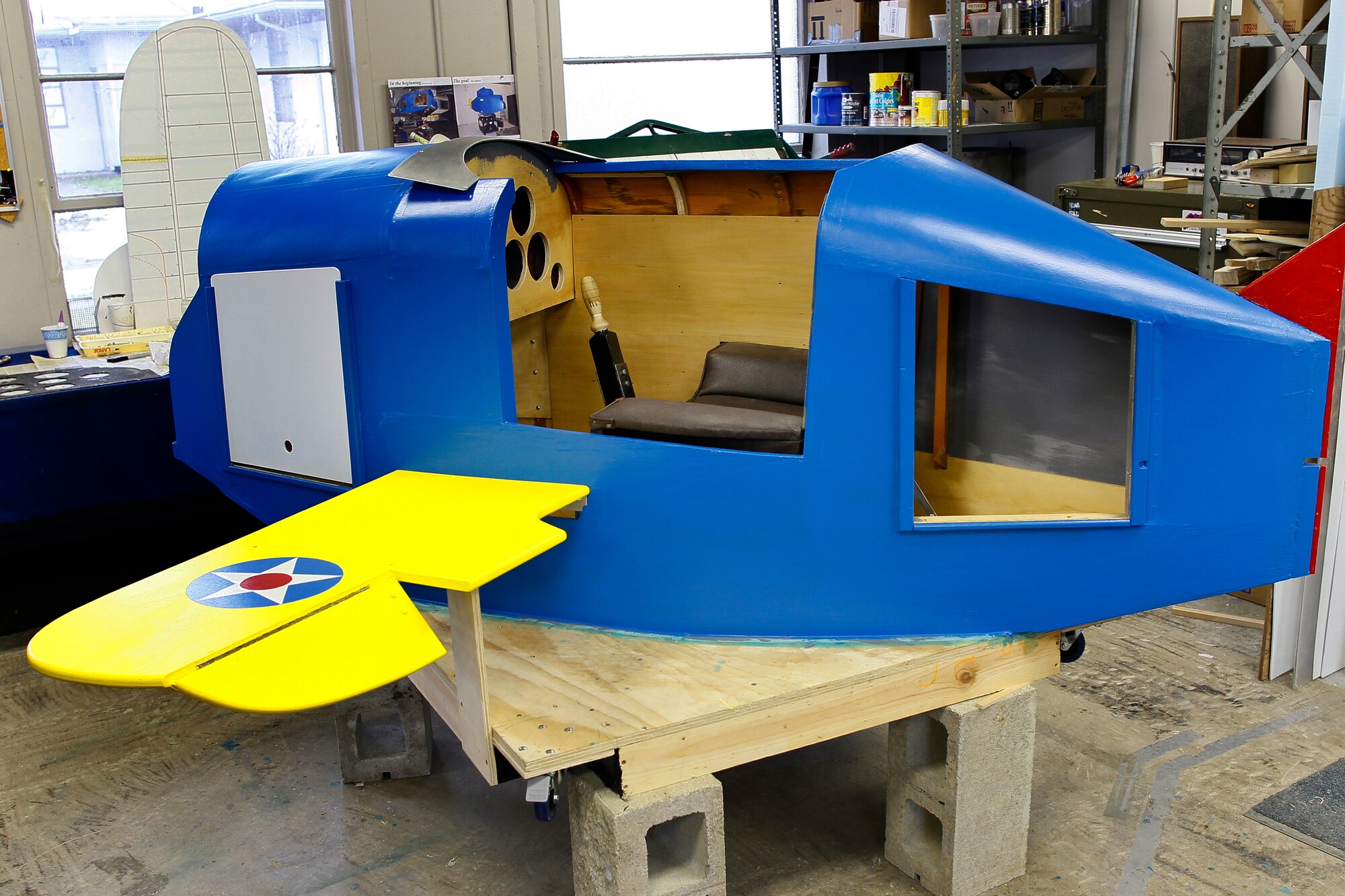 A replica of a World War II-era Link Trainer is being prepared for display at the Selfridge Military Air Museum, March 10, 2011. Children will be able to sit in the trainer and work the controls. An authentic Link Trainer is currently being restored by museum volunteers for future display. (U.S. Air Force photo by MSgt. Terry Atwell)(RELEASED)