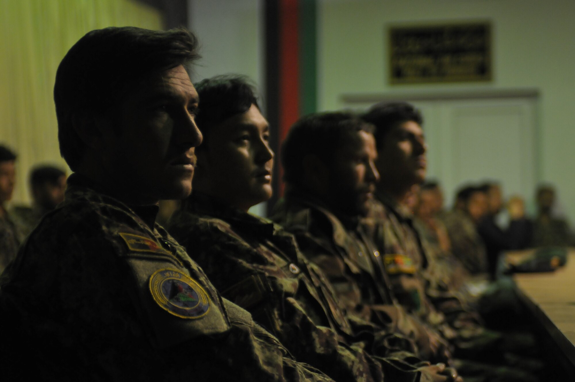 KABUL, Afghanistan - Afghan airman wait to be presented gifts from their superiors in the Afghan Air Force during a ceremony highlighting the hard work of junior Afghan airman at the Afghan Air Force base in Kabul, Afghanistan, March 19. (U.S. Navy photo by Mass Communications Specialist 2nd Class Vladimir Potapenko).