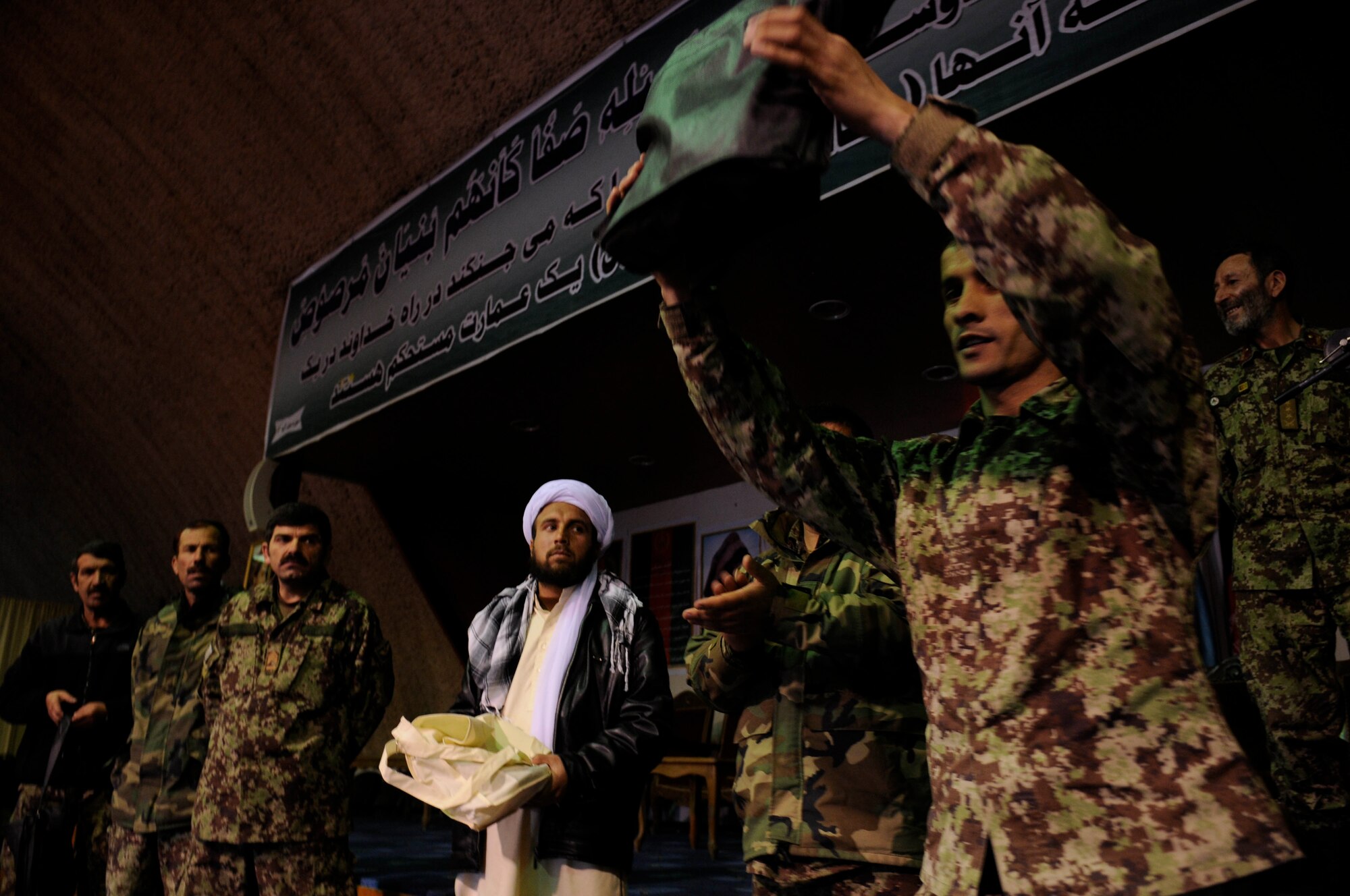 KABUL, Afghanistan - Afghan airman 
shows a gift that his superiors in the Afghan Air Force gave to him during a ceremony highlighting the hard work of Afghan airman at the Afghan Air Force base in Kabul, Afghanistan, March 19. (U.S. Air Force photo by Tech. Sgt. Brian E. Christiansen)