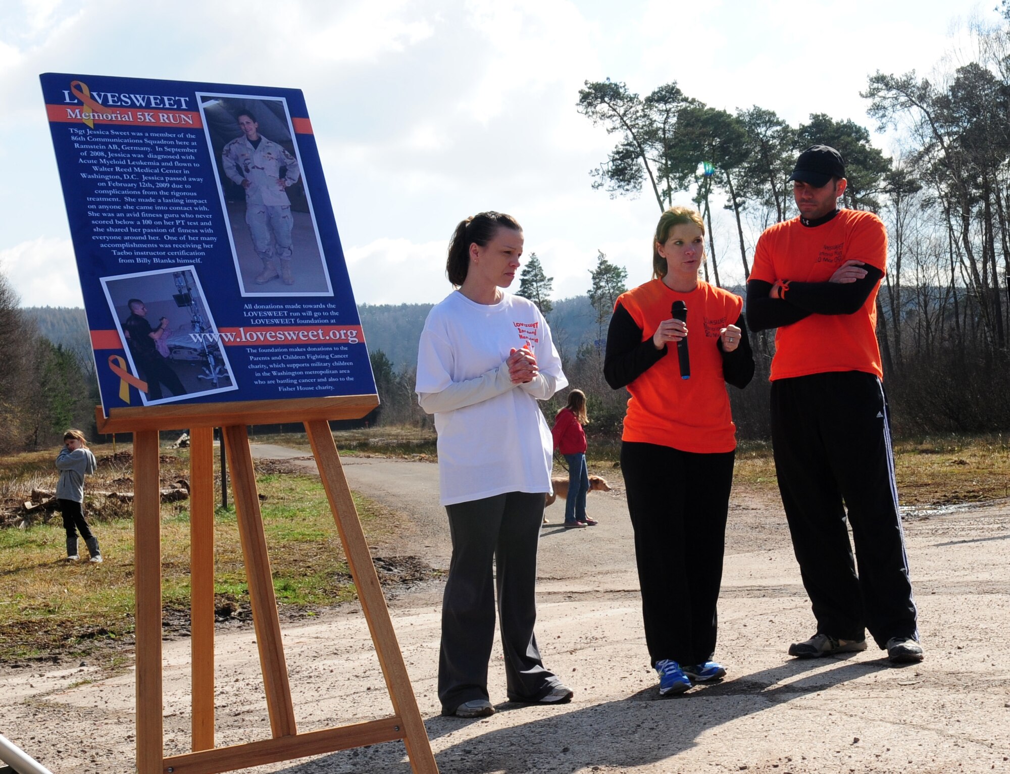 U.S. Air Force Tech. Sgt. Monica Pubillones, 86th Operations Support Squadron, talks about her friend Tech. Sgt. Jessica Sweet, 435th Communications Squadron, before the 3rd Annual LOVESWEET Memorial 5k Run, Ramstein Air Base, Germany, March 19, 2011. The run was in honor of Tech. Sgt. Jessica Sweet, 435th Communications Squadron supply airman, who lost the battle against Acute Myeloid Leukemia in 2009. (U.S. Air Force photo by Senior Airman Brittany Perry)