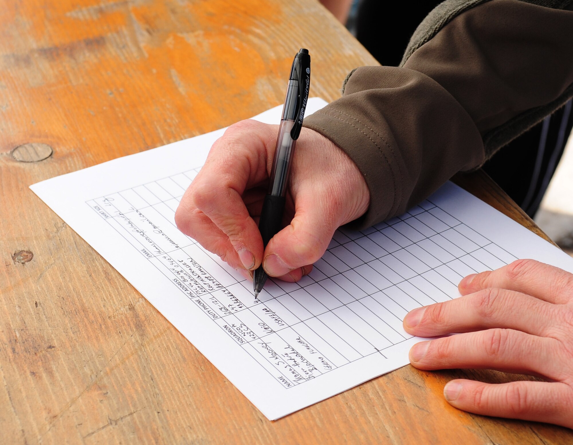 A participant signs up for the 3rd Annual LOVESWEET Memorial 5k Run, Ramstein Air Base, Germany, March 19, 2011. The run was in honor of Tech. Sgt. Jessica Sweet, 435th Communications Squadron supply airman, who lost the battle against Acute Myeloid Leukemia in 2009. (U.S. Air Force photo by Senior Airman Brittany Perry)