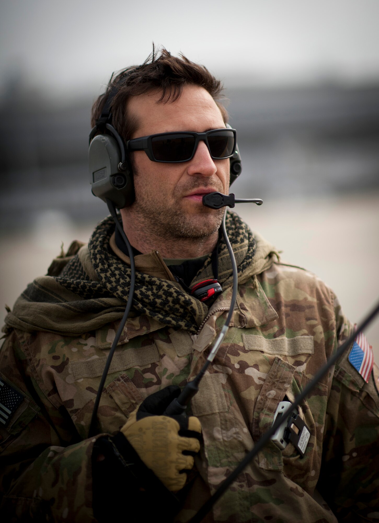 The 320th Special Tactics Squadron airfield commander monitors the offloading of a C-17 Globemaster III at Sendai Airport, Japan, March 20. This was the first C-17 to land at Sendai Airport following the devastating 9.0-magnitude earthquake and subsequent tsunami that occurred March 11. (U.S. Air Force photo/Staff Sgt. Samuel Morse)