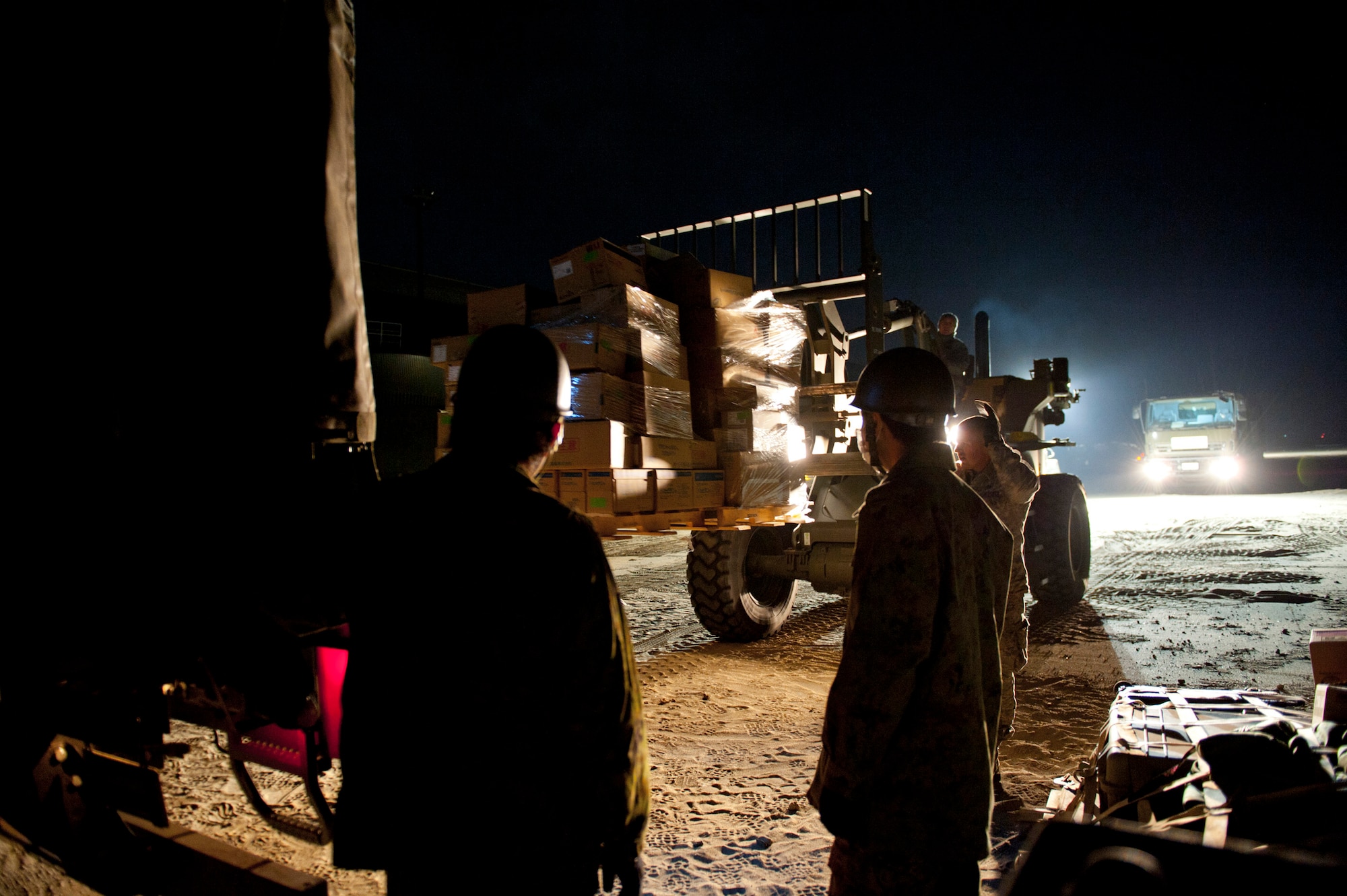 Members of the 353rd Special Operations Group from Kadena Air Base, Japan, load medical supplies onto a Japan Ground Self-Defense Force truck at Sendai Airport March 19. Sendai Airport has become a hub for bringing humanitarian aid and other supplies after the March 11 earthquake and tsunami. (U.S. Air Force photo/Staff Sgt. Samuel Morse)
