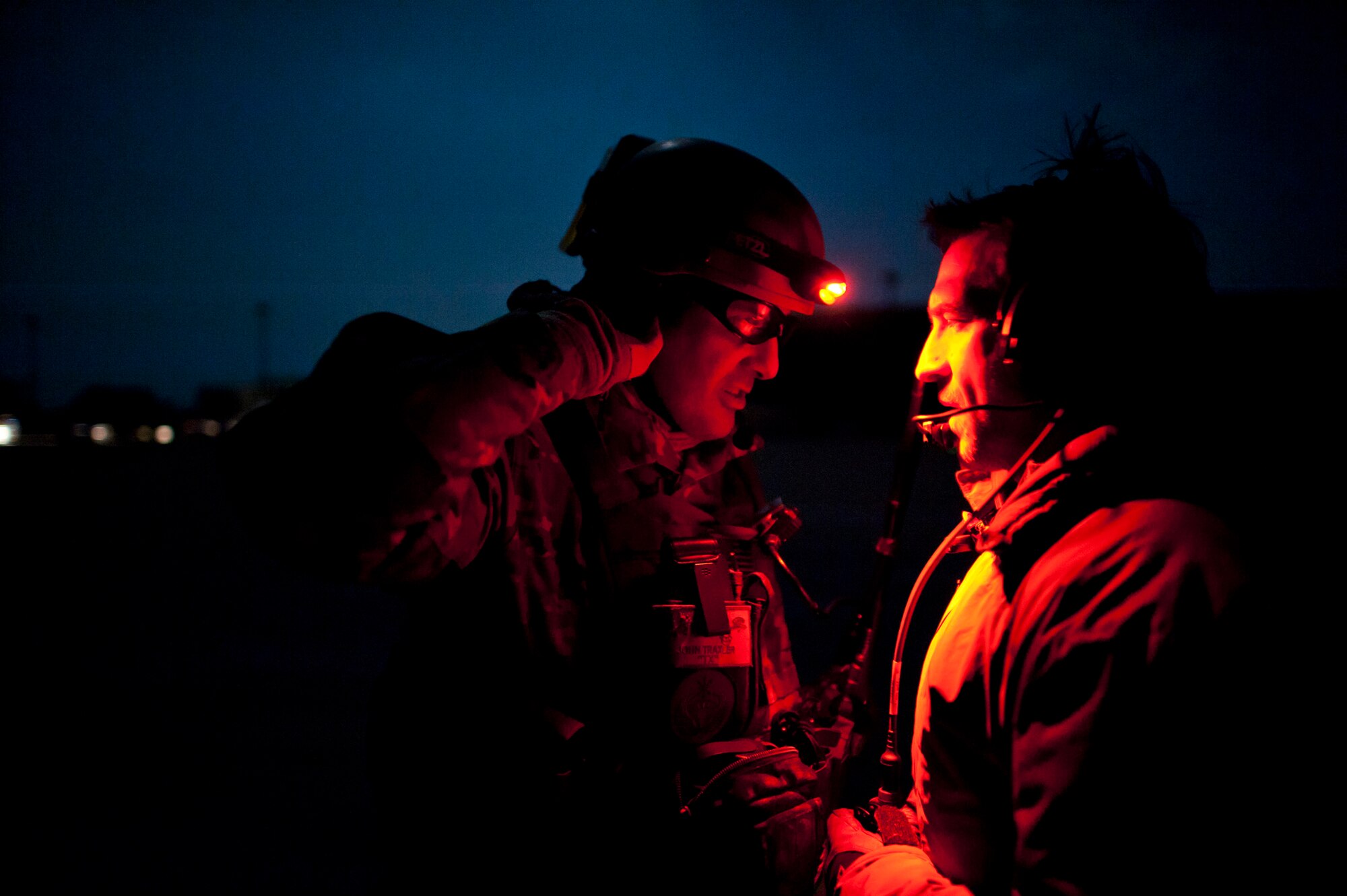 Maj. John Traxler (left), 320th Special Tactics Squadron commander, speaks with the airfield commander shortly after landing at Sendai Airport March 19. The 320th STS is supporting U.S. military efforts to provide assistance to Japan following the March 11 earthquake and tsunami. (U.S. Air Force photo/Staff Sgt. Samuel Morse)