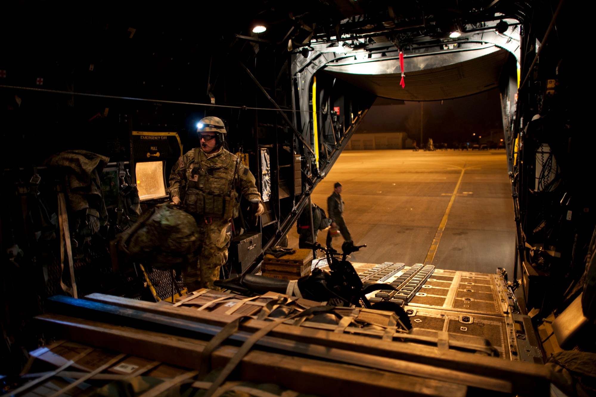 Maj. John Traxler, 320th Special Tactics Squadron commander, boards an MC-130P Combat Shadow bound for Sendai Airport from Yokota Air Base, Japan, March 19 as part of Operation Tomodachi. The 320th STS is supporting U.S. military efforts to provide assistance to Japan following the March 11 earthquake and tsunami. (U.S. Air Force photo/Staff Sgt. Samuel Morse)