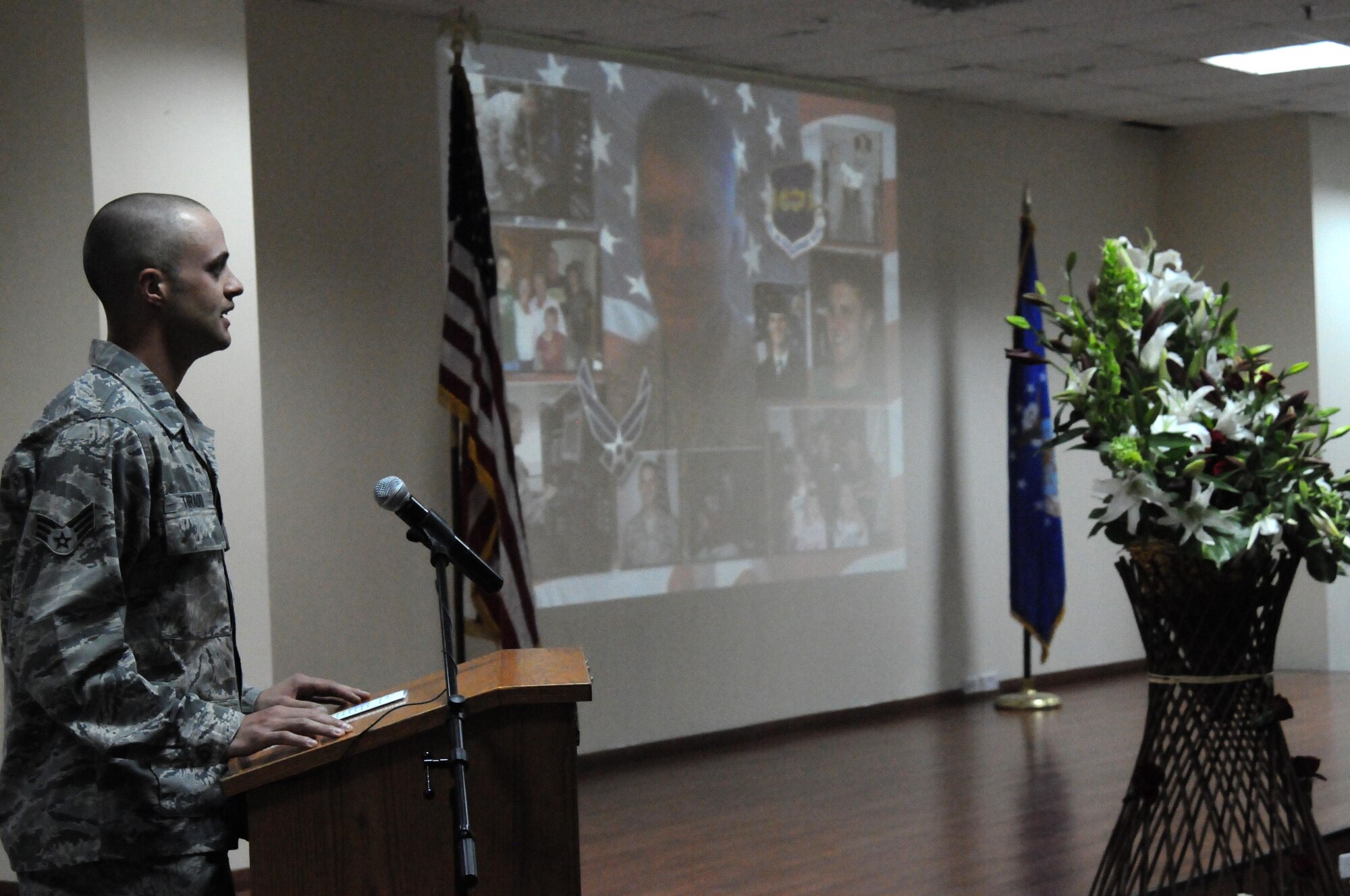 Senior Airman Antonio Tirado, 386th Expeditionary Communications Squadron, shares a memory of Senior Airman Michael J. Hinkle II with the rest of the 386th Air Expeditionary Wing during a memorial service March 19 at an undisclosed location in Southwest Asia. The 386th AEW held a memorial service to remember the life of Airman Hinkle who died from a non-combat related incident March 16. (U.S. Air Force photo by Staff Sgt. Patrice Clarke). 