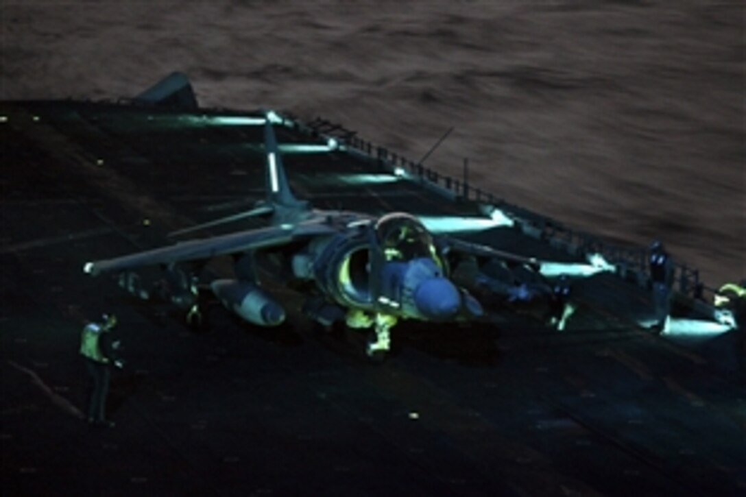 An AV-8B Harrier jump jet returns to USS Kearsarge for fuel and ammunition resupply in support of Joint Task Force Odyssey Dawn, March 20, 2011. The jet is from the Marine Medium Tiltrotor Squadron, 26th Marine Expeditionary Unit. Coalition forces launched the operation to enforce U.N. Security Council Resolution 1973, which protects the Libyan people from their ruler. 