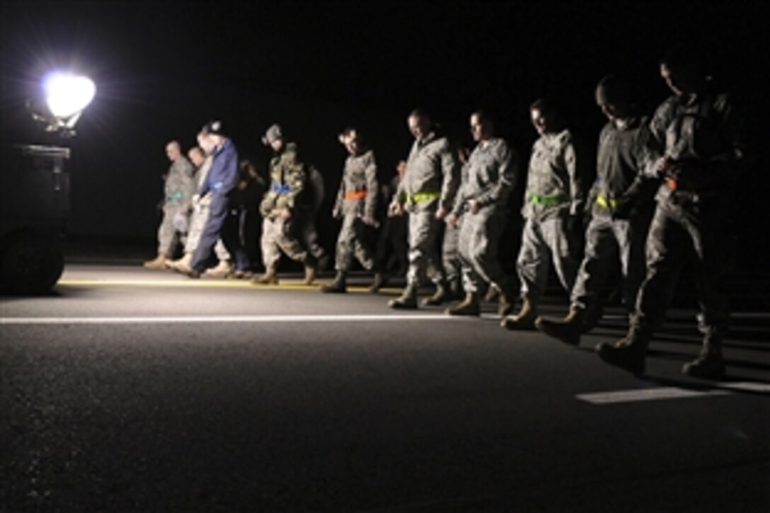 U.S. Air Force airmen perform a foreign objects and debris inspection of a taxi-way on Spangdahlem Air Base, Germany, March 19, 2011, to prepare for the take-off of a U.S. Air Force F-16 Fighting Falcon fighter aircraft from the 480th Fighter Squadron in support of Joint Task Force Odyssey Dawn. Coalition forces launched the operation to enforce U.N. Security Council Resolution 1973, which protects the Libyan people from their ruler. 