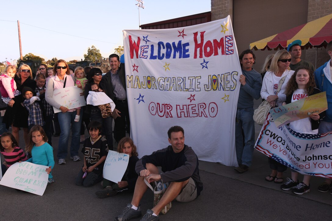 Families wait for Marines and sailors with I Marine Expeditionary Force (FWD) to return from a year-long deployment to Afghanistan March 22.  More than 170 Marines and sailors were welcomed home.