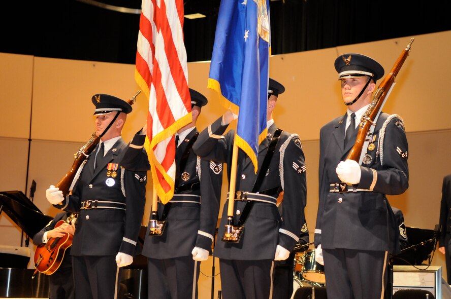 From left to right, Airman 1st Class Kenneth Snow, Staff Sgt. Jesse Schierloh, Senior Airman Ryan Nelson and Airman 1st Class Brent Dutcher, members of The U.S. Air Force Honor Guard color guard, present the colors March 19 at the University of Tennessee, Knoxville, Tenn., to begin the show. The color guard travels with the U.S. Air Force Band’s Airmen of Note ensemble to present the colors at each performance. (U.S. Air Force photo by Airman 1st Class Tabitha N. Haynes)
