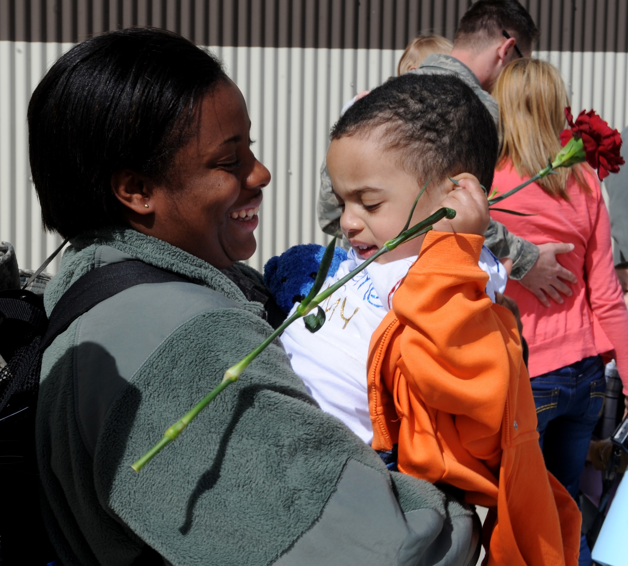 MOUNTAIN HOME AIR FORCE BASE, Idaho – Senior Airman Tiffany Dunston, 726th Air Control Squadron, reunites with her son, Maurice after returning from a deployment to Southwest Asia in support of Operation New Dawn, March 19. The 726th ACS mission is to provide unparalleled air battle management to joint air, land and sea power anytime, anywhere and has consistently deployed one-third of its squadron for the last four years. (U.S. Air Force photo by Senior Airman Debbie Lockhart)