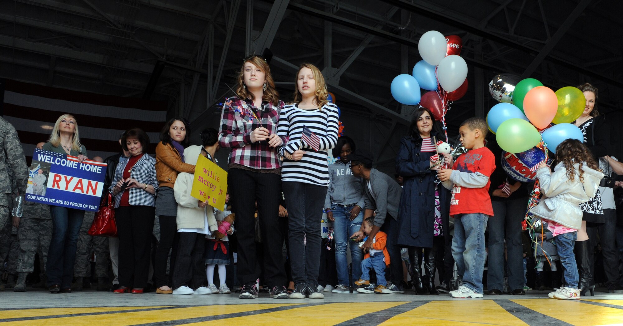 MOUNTAIN HOME AIR FORCE BASE, Idaho –Family and friends wait in hangar 1331 for loved ones to return from a deployment to Southwest Asia, March 19. Approximately 200 Airmen from the 726th Air Control Squadron returned from a deployment in support of Operation New Dawn. The 726th ACS mission is to provide unparalleled air battle management to joint air, land and sea power anytime, anywhere. (U.S. Air Force photo by Senior Airman Debbie Lockhart)