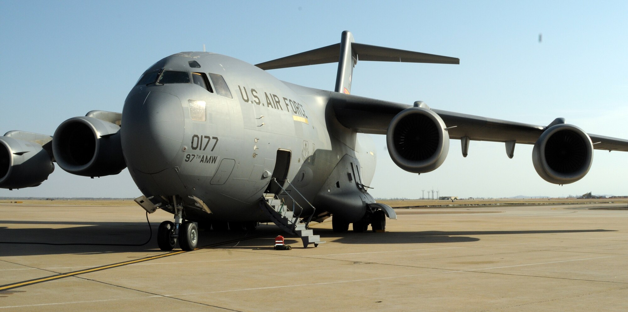 ALTUS AIR FORCE BASE, Okla. -- An Altus C-17 Globemaster III is prepared on the flightline for take-off March 22, in support of Operation Odyssey Dawn. Two Altus C-17s departed in support of Operation Odyssey Dawn March 22 as part of ongoing operations in Libya. (U.S. Air Force photo by Airman 1st Class Kenneth W. Norman/ Released 97th Air Mobility Wing Public Affairs.)