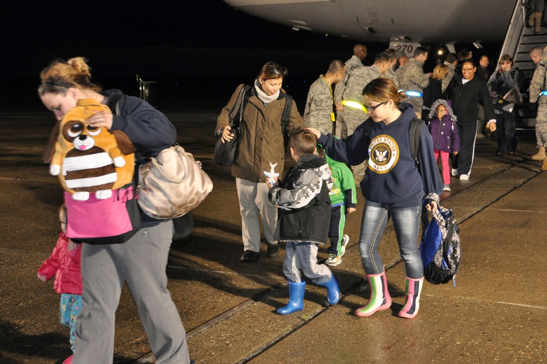 Passengers arriving from Japan of the DC-10 military-chartered flight de-boarded March 22, 2011, at Travis Air Force Base, Calif. Service members, family members and civil service employees voluntarily left Japan in efforts to assist and expedite recovery efforts in the country by reducing the demand for food, water, fuel and electricity during this national emergency while hundreds of thousands of Japanese citizens remain displaced. (U.S. Air Force photo/Airman 1st Class Michael Battles)