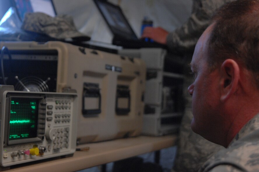 NEVADA TEST AND TRAINING RANGE, Nev.-- Master Sgt. Jan Johannes, 822nd Base Defense Squadron communication division chief from Moody Air Force Base, Ga., checks the operability of radio equipment March 15, 2011, after the end of DESERT EAGLE. This 54-hour exercise gave the 822nd BDS a chance to enhance their combat skills with British Airmen from 1 Squadron Royal Air Force Regiment. (U.S. Air Force photo/Airman 1st Class Brigitte N. Brantley-Sisk)(RELEASED)
