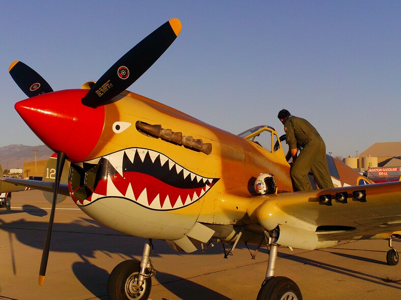 DAVIS-MONTHAN AIR FORCE BASE, Ariz.-- A Curtiss P-40 Warhawk is prepared for flight during the at the 2011 Air Combat Command Heritage Flight Conference March 12. (Contributed photo) (RELEASED)