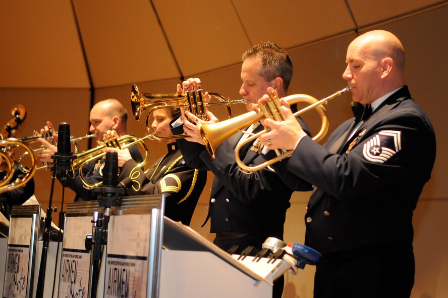 From left to right, Master Sgt. Richard B. Sigler, jazz trumpeter with the Airmen of Note, Sgt. 1st Class Liesl Whitaker, lead trumpeter with the U.S. Army’s Army Blues jazz ensemble, Senior Master Sgt. Kevin Burns, split lead trumpeter with the Airmen of Note, and Senior Master Sgt. Timothy Leahey, jazz trumpeter with the Airmen of Note, play the flugelhorn March 19 at the University of Tennessee, Knoxville, Tenn. The Note is traveling through Virginia, Tennessee, Mississippi and Arkansas on its 2011 Spring Tour. (U.S. Air Force photo by Airman 1st Class Tabitha N. Haynes)