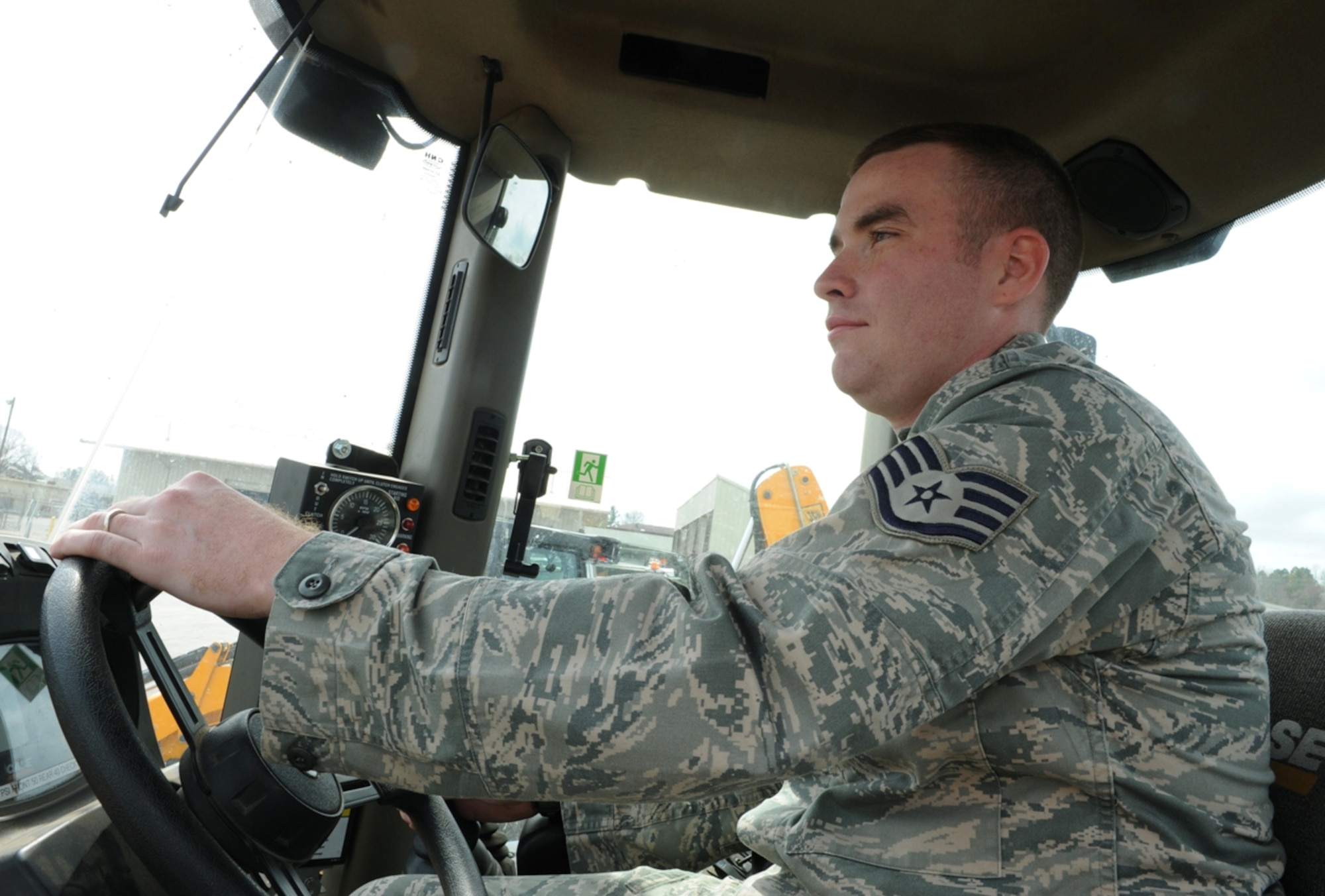 Staff Sgt. Stephen Bryant, a 19th Civil Engineer Squadron pavement and equipment craftsman, prepares to drive a loader at Little Rock Air Force Base, Ark., March 21, 2011. Sergeant Bryant helped build 150 feet of sidewalk, enhancing visiting officer quarters and made emergency repairs to 30 feet of base perimeter fencing. (Air Force photo by Airman 1st Class Ellora Stewart)