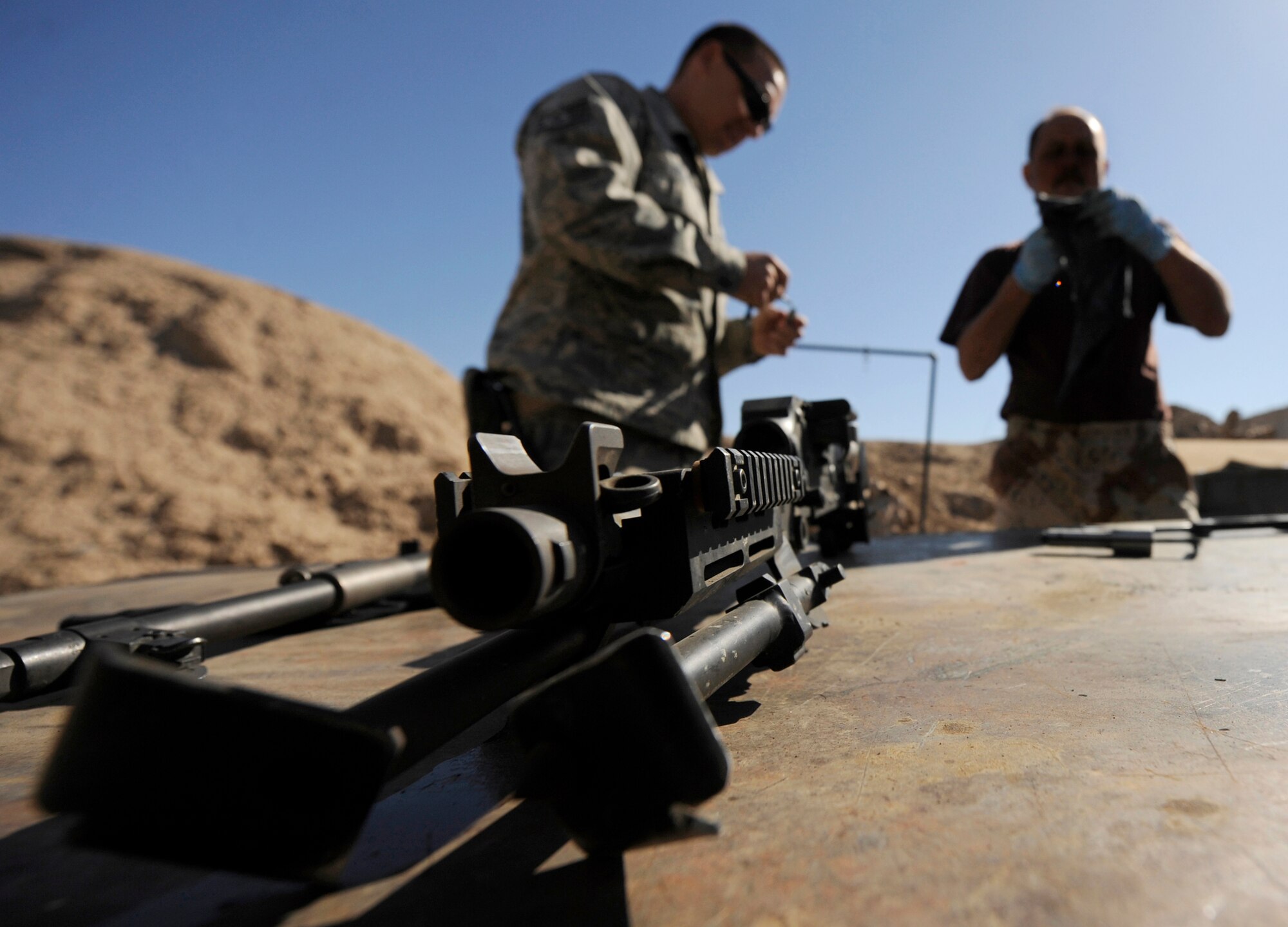 Tech. Sgt. Bryan Felix trains Iraqi army aviation command soldiers to clean M240 machine guns March 17, 2011, at Camp Taji, Iraq. Sergeant Felix is a 721st Air Expeditionary Advisory Squadron weapons adviser. (U.S. Air Force photo/Tech. Sgt. Jason Lake) 