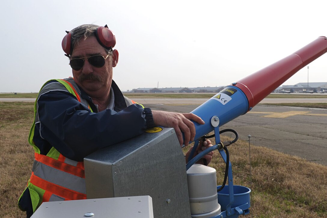 Joe Cox, 1st Maintenance Squadron Scare Wars project maintainer, connects the gas valve on a remote bird deterrent unit on Langley Air Force Base, Va., March 21, 2011. Scare Wars is an abatement system that uses liquefied petroleum gas cannons to scare away birds on the airfield to prevent damage to aircraft and personnel. (U.S. Air Force photo by Staff Sgt. Ashley Hawkins/Released)