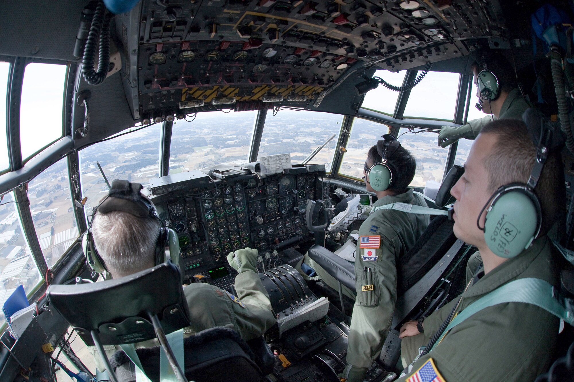 Aircrew members assigned to the 36th Airlift Squadron fly March 19, 2011, above Japan, en route to deliver seven pallets of boron to Japan Air Self-Defense Force members at Hyakuri Air Base, Japan. (U.S. Air Force photo/Osakabe Yasuo)